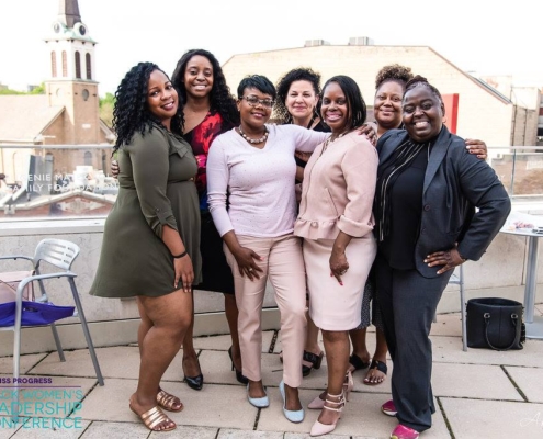 Women smiling at the Black Women’s Leadership Conference